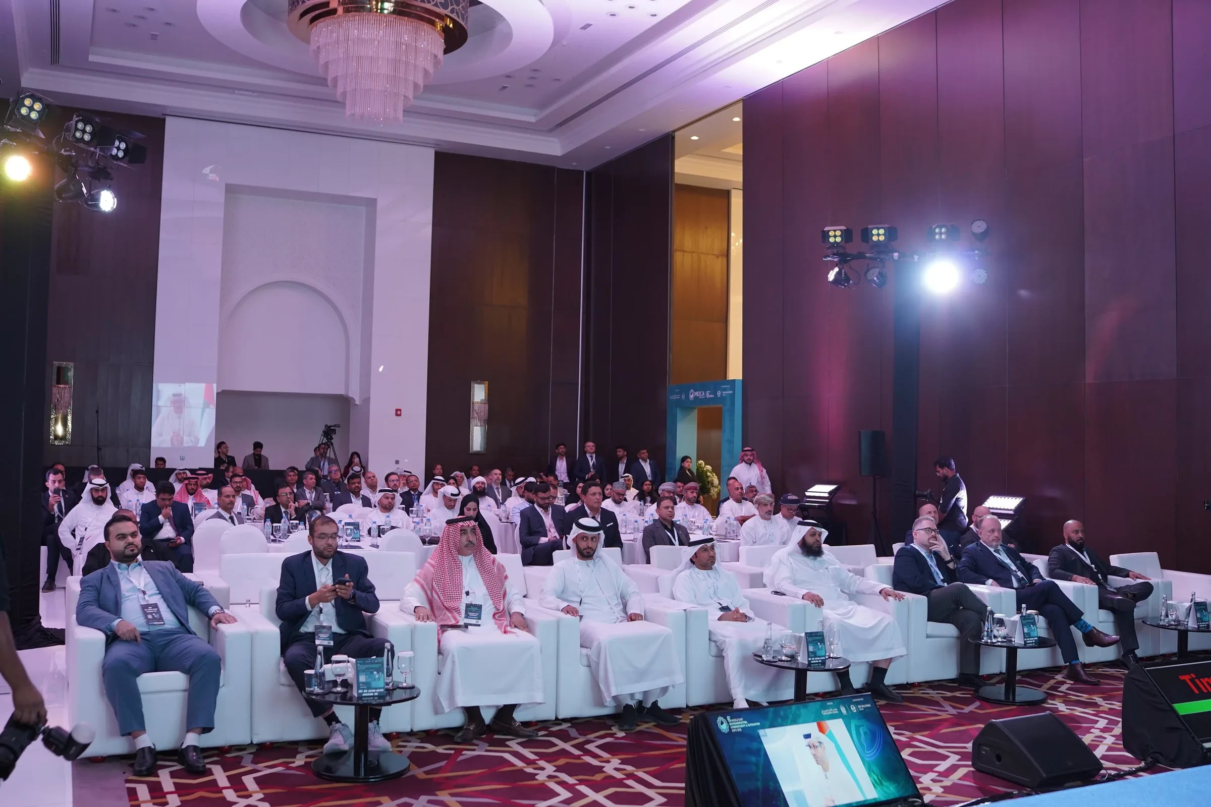 Delegates seated in the plenary hall listening to a speaker at MEICA Expo