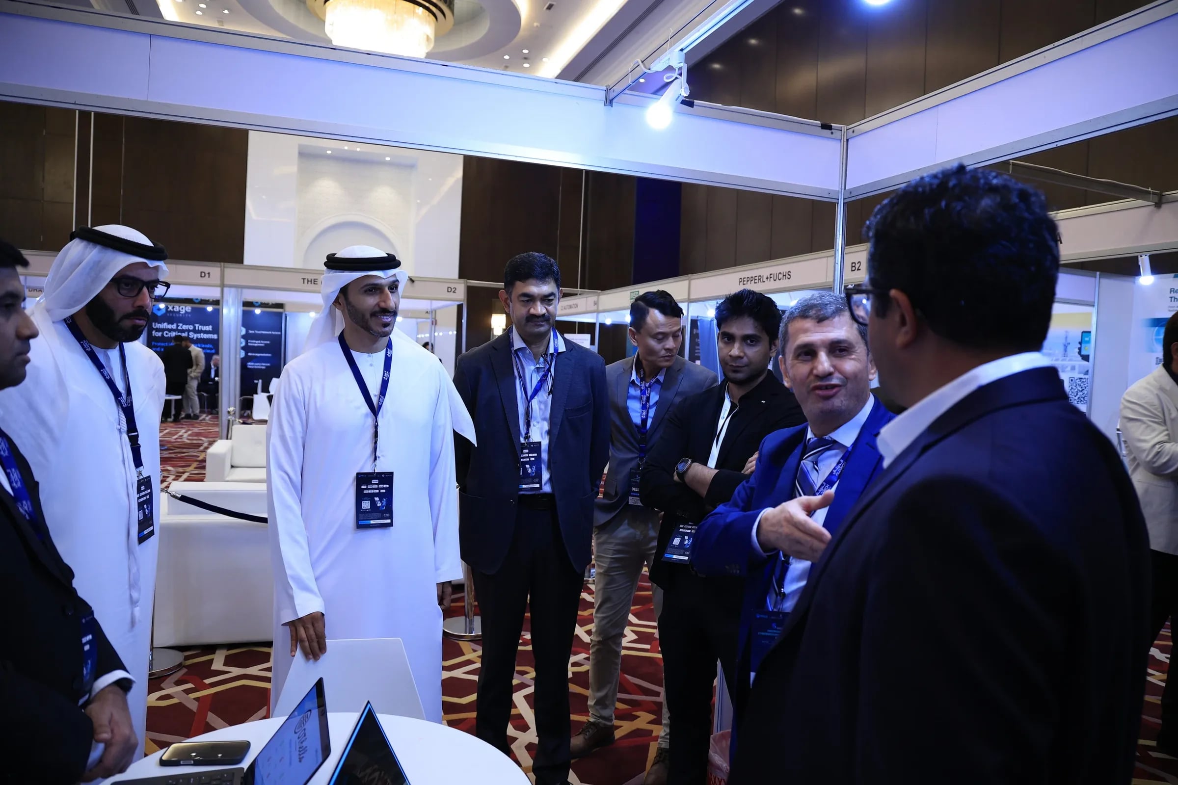 Delegates networking at a MEICA Expo exhibitor stand