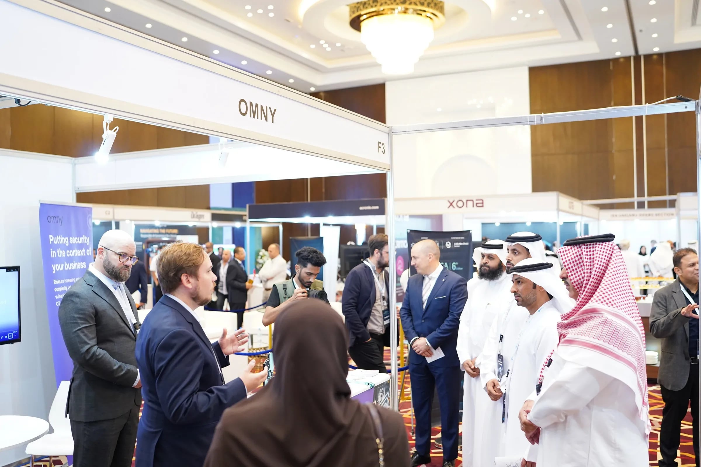 Delegates engaging with an exhibitor on the MEICA Expo show floor